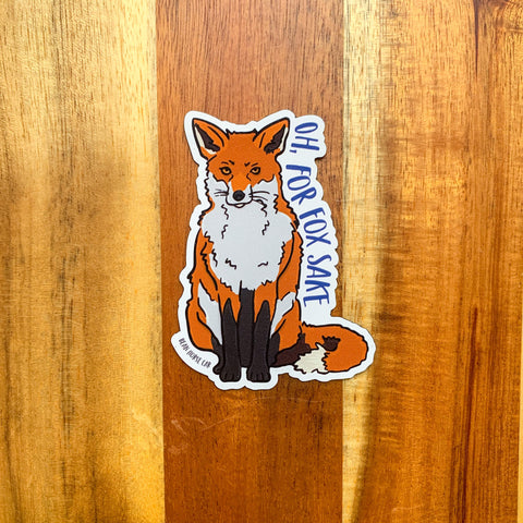 The For Fox Sake Magnet featuring a seated red fox. Text reads, 